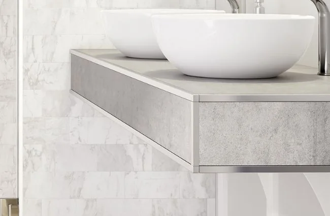 Cleaning adhesive from tile edge trim immediately after installation