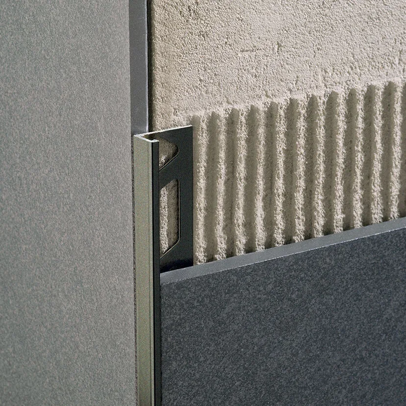 Embedding and aligning tile edge trim in fresh adhesive