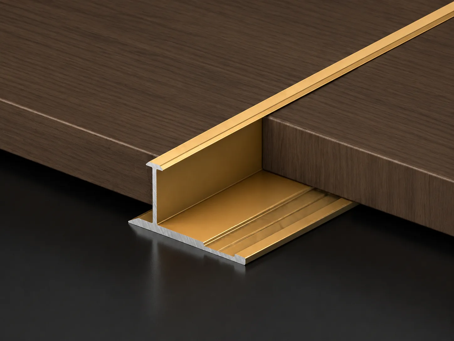 Gold H-shaped aluminum molding connecting two wood panels