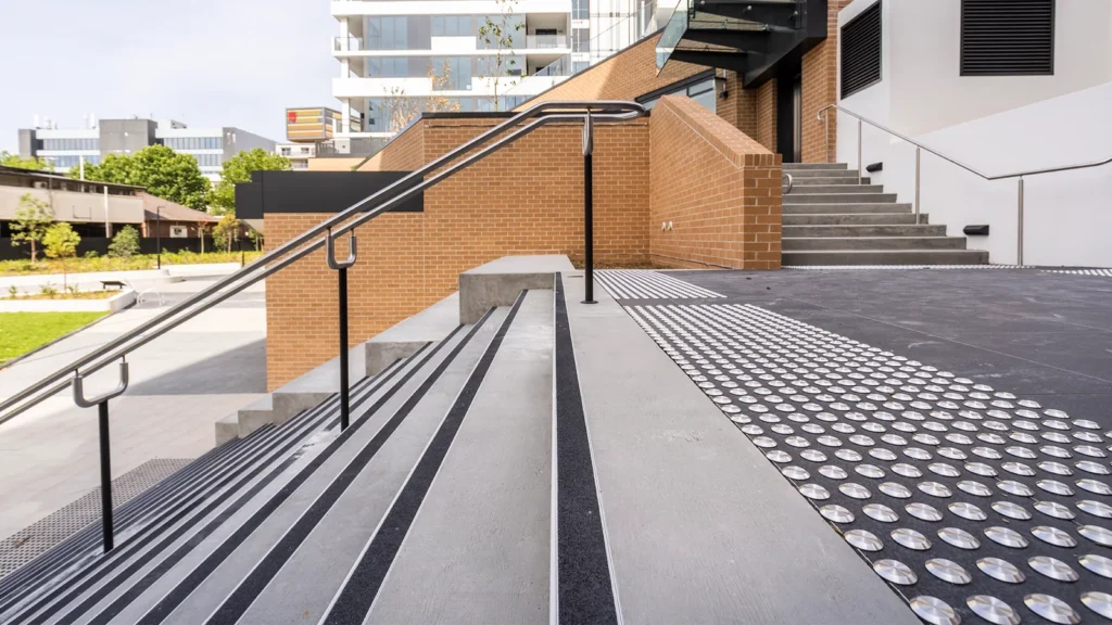 Aluminum stair nosing profiles for adhesive, screw, and concrete installation