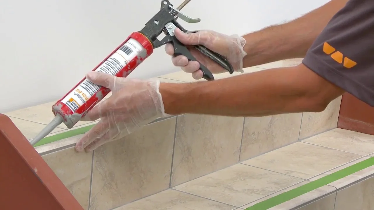 Installing aluminum stair nosing with construction adhesive