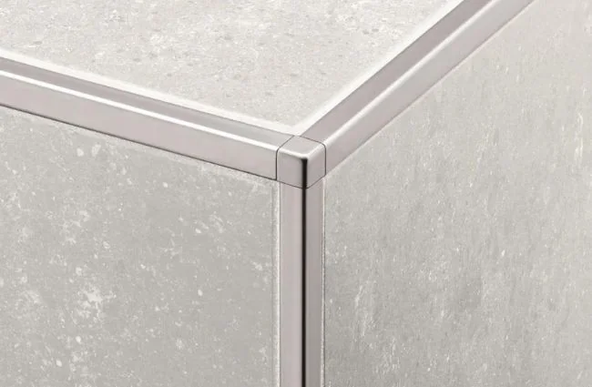 Installing tile edge trim around an outside wall corner