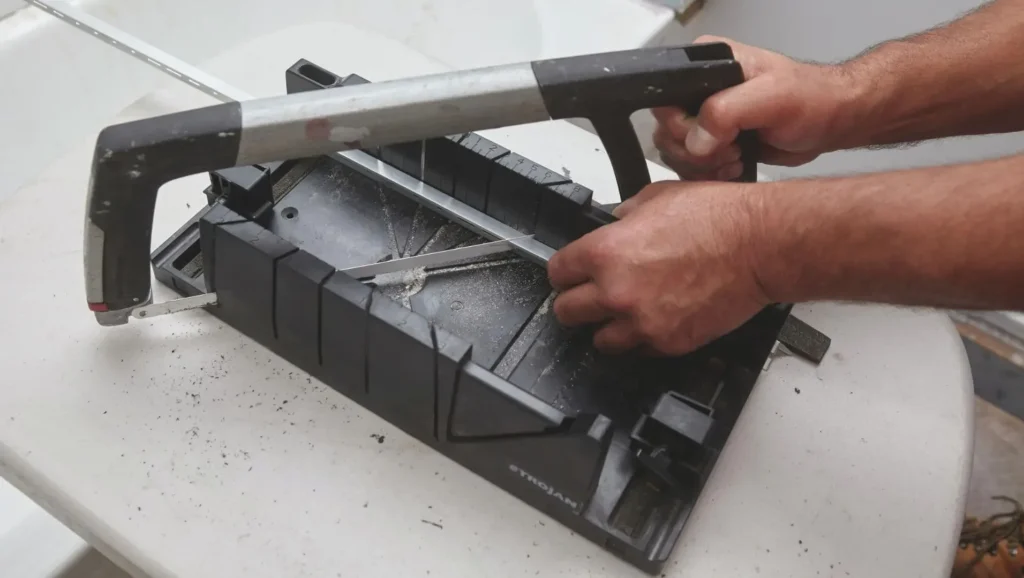 Measuring and cutting aluminum tile edge trim to the required length