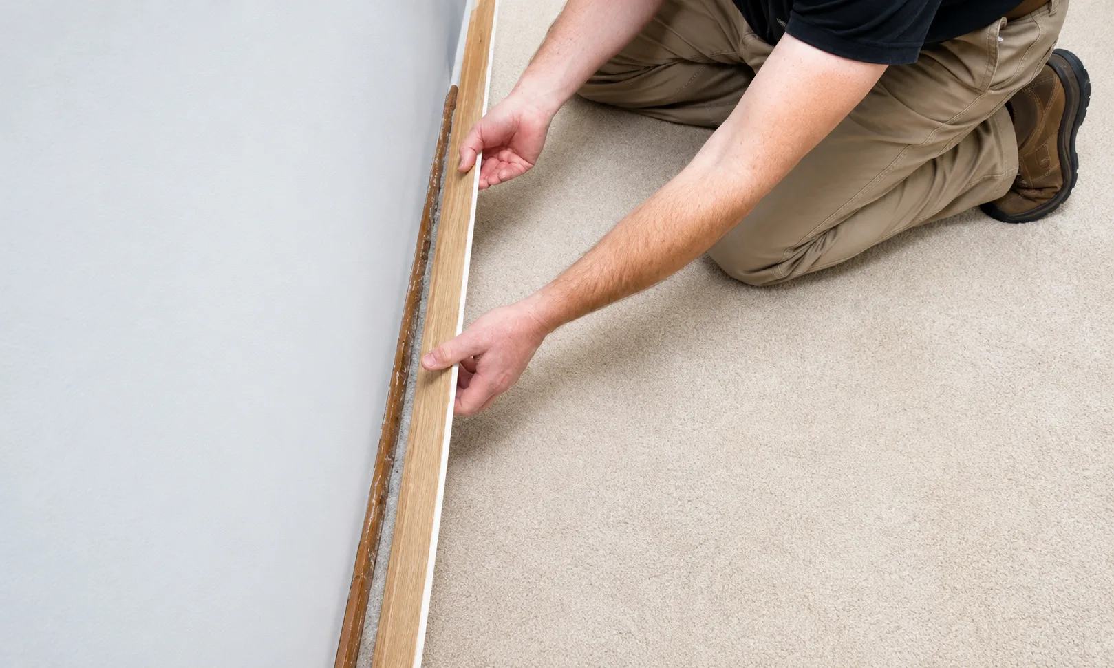 Working gradually along a skirting board while pulling it away from the wall