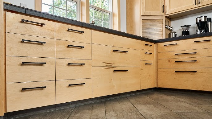 Kitchen cabinet handles placed near the upper corner of base cabinet doors