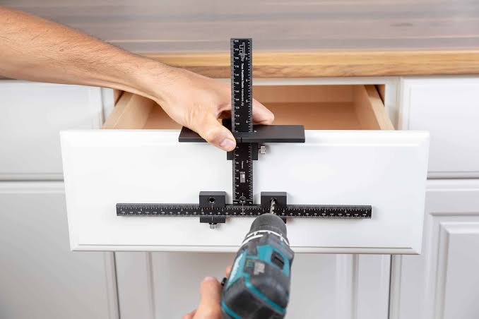 Cabinet hardware jig used to align kitchen cabinet handles before drilling