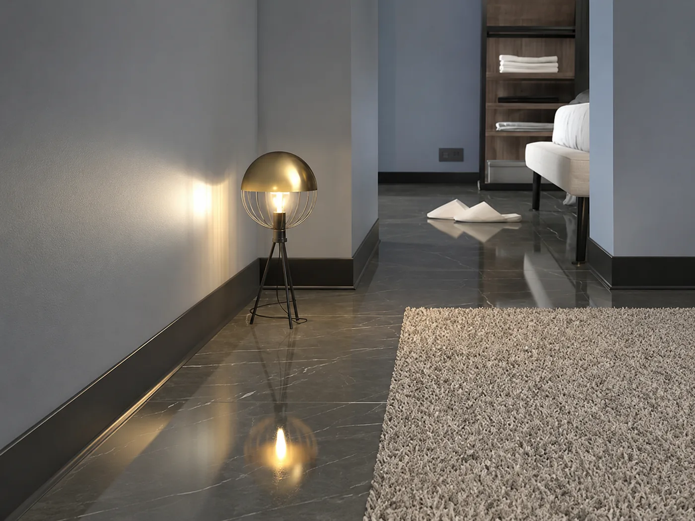 Adhesive-mounted modern aluminum baseboard installed on a finished wall