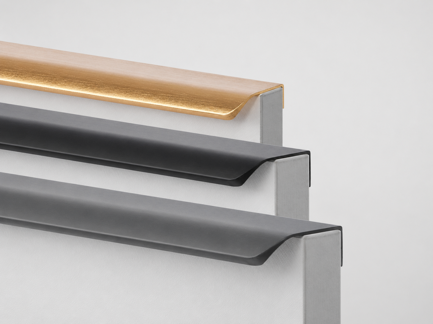 Aluminum edge pulls and finger pull profiles for handleless cabinet designs