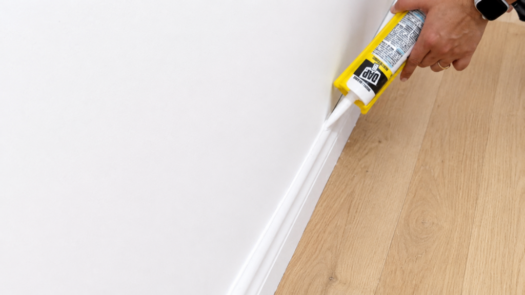 Filling nail holes and gaps after baseboard molding installation