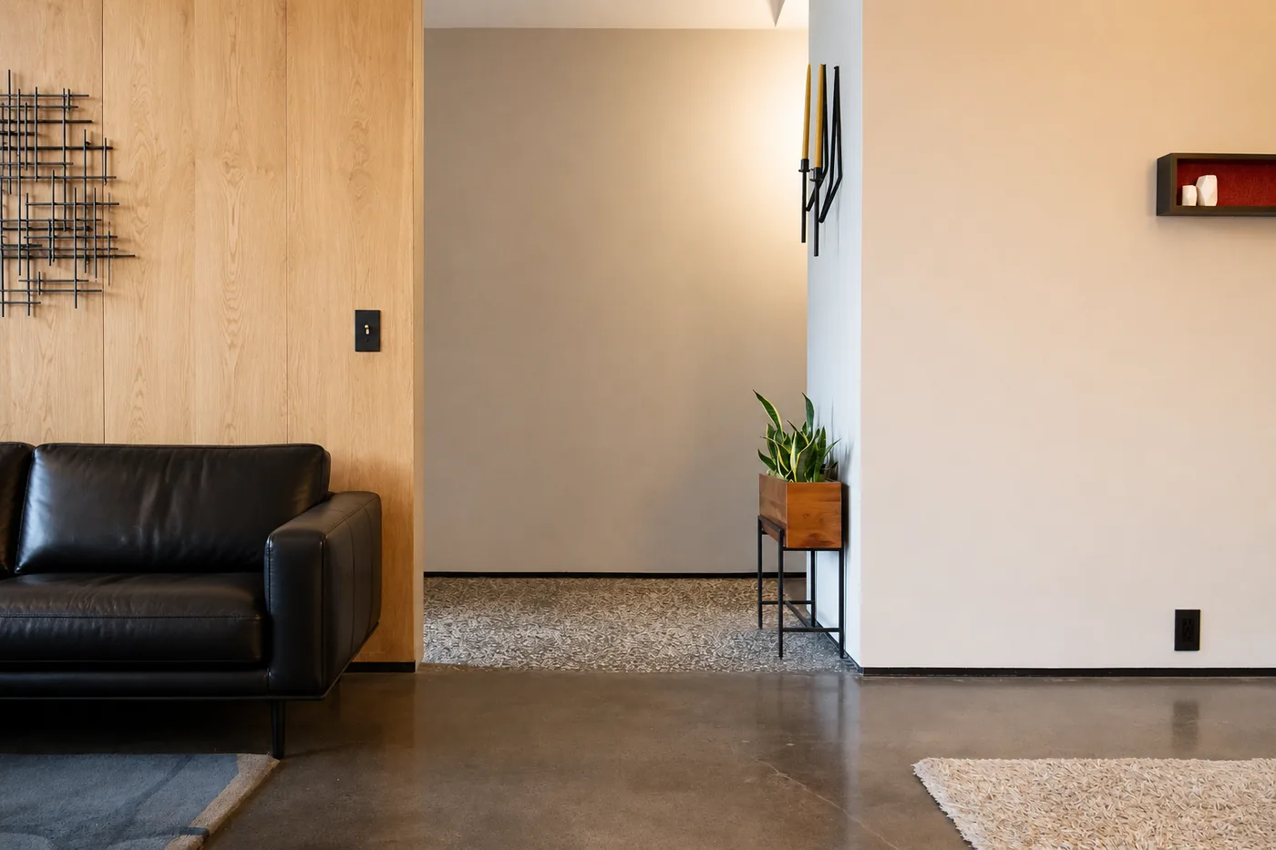 Recessed modern aluminum baseboard installed flush with a wall in a minimalist interior