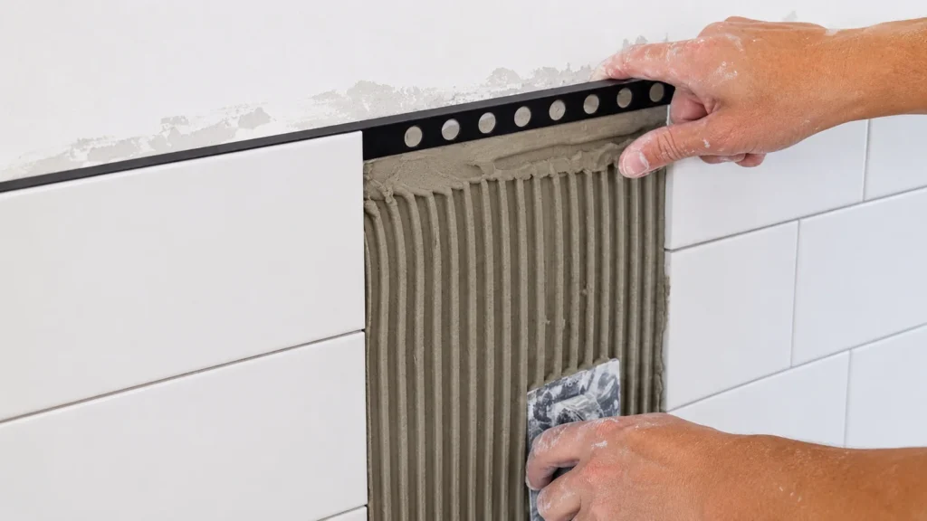 aluminum tile trim protecting a detailed tiled corner
