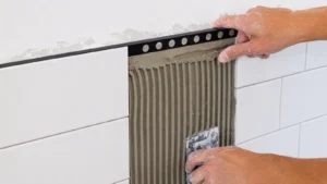 aluminum tile trim protecting a detailed tiled corner