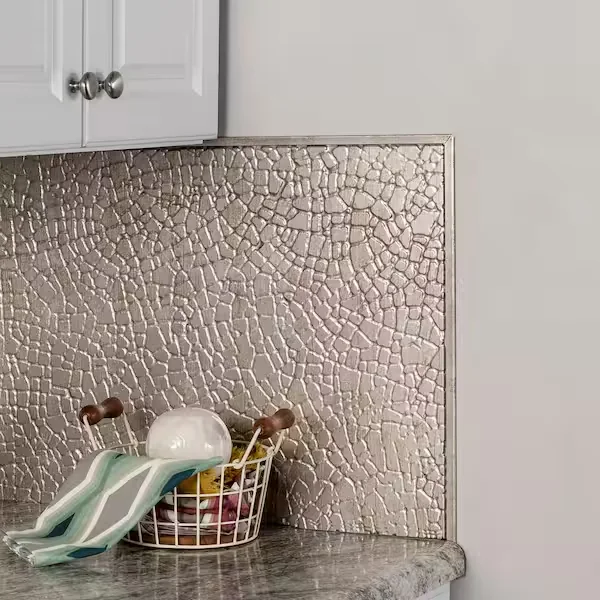 Metal edge trim finishing a kitchen backsplash