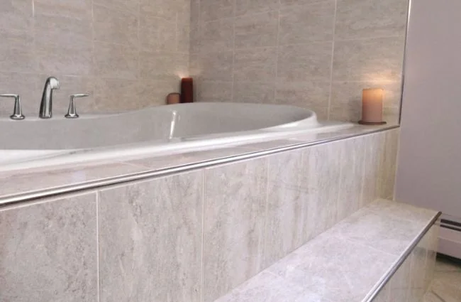 Metal edge profile installed with a modern large-format tile