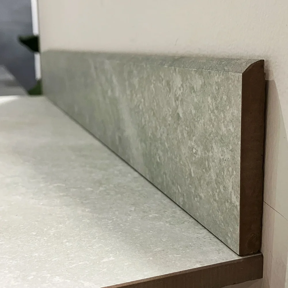 Use a factory-finished tile edge for a clean exposed boundary