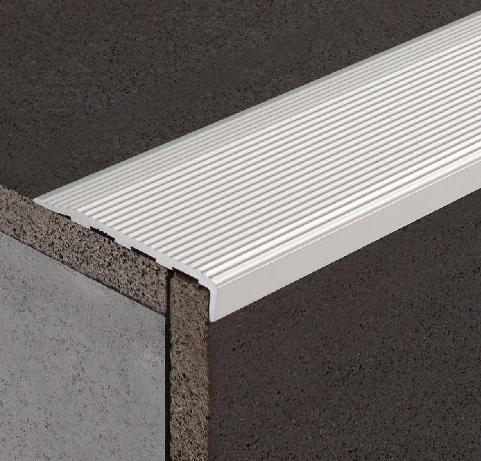 Surface-mounted metal nosing fitted over an existing stair edge