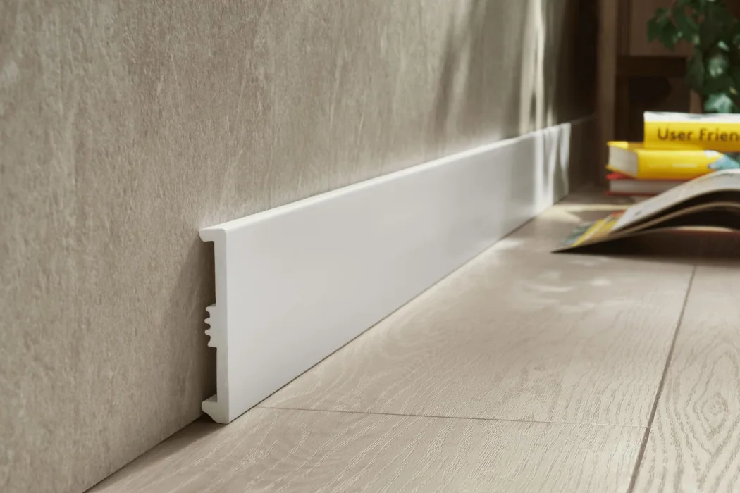 Plastic skirting board profile used as a wall-to-floor finish