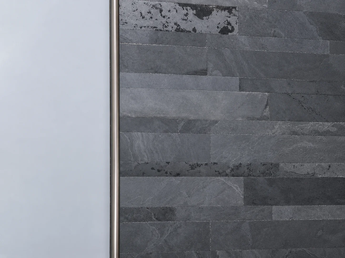 Aluminum backsplash tile trim in a kitchen installation