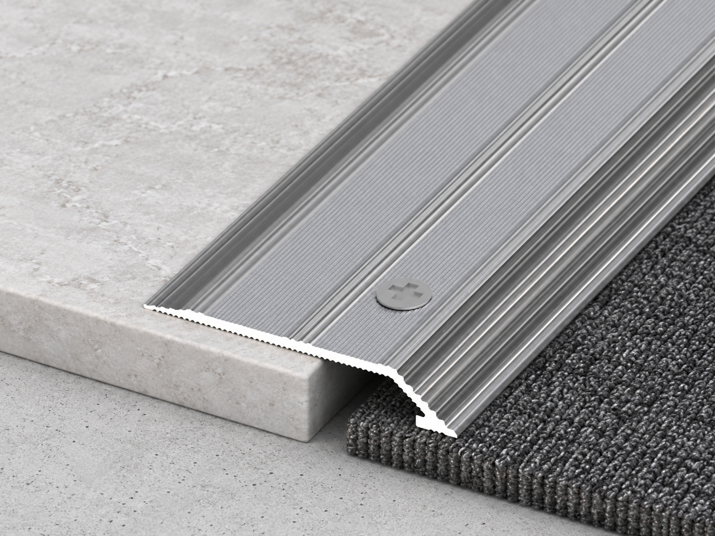 Flat carpet edge trim bridging carpet and tile